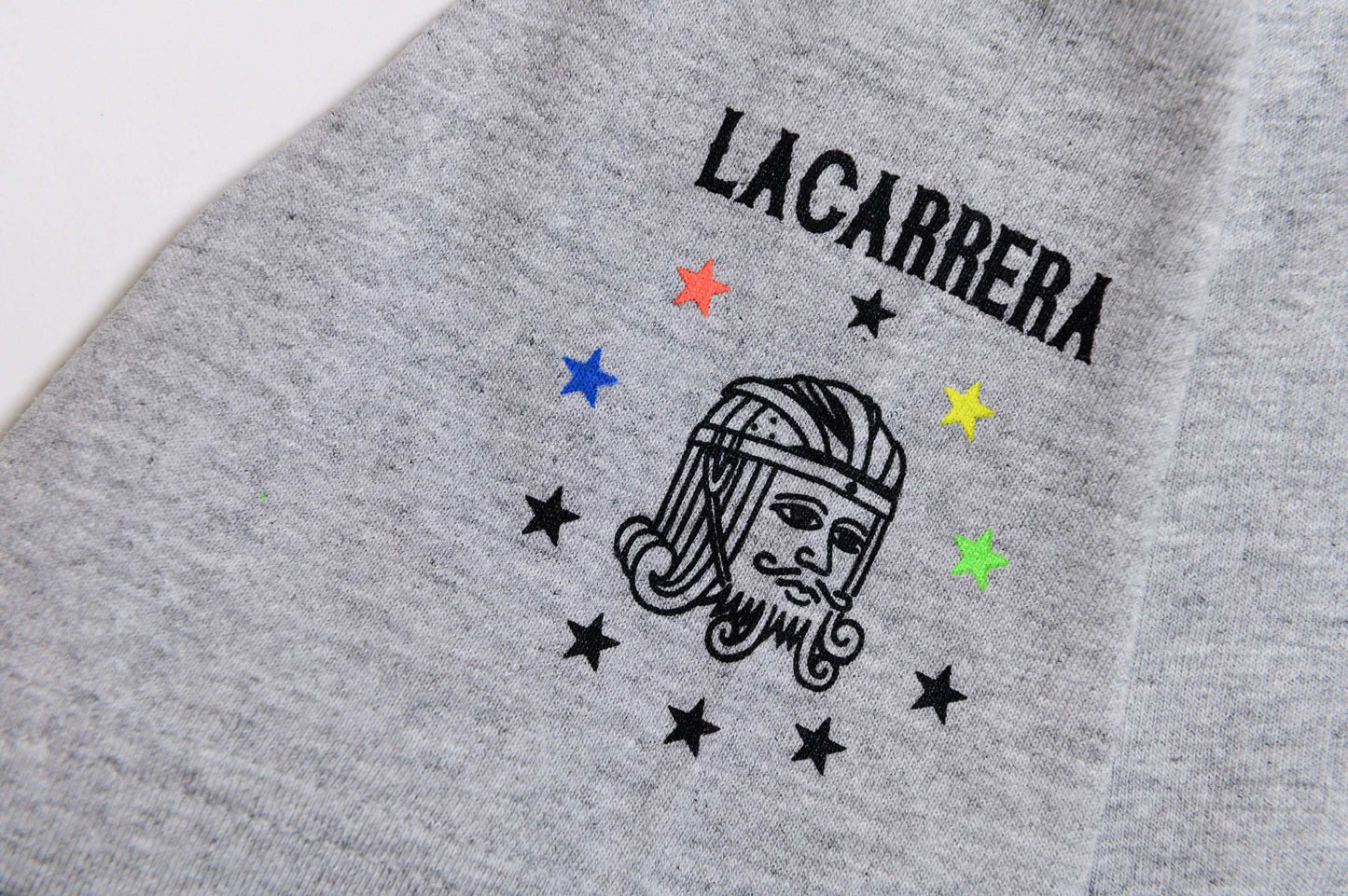 Close-up sleeve hit view of Il Campionissimo tee by LCCC with focus on material and graphic