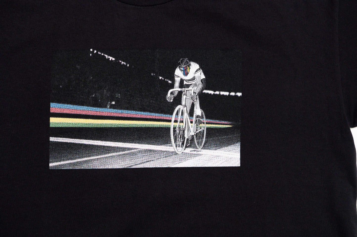 Zoomed-in-close-up of front graphic print and soft texture on Il Campionissimo tee by LCCC