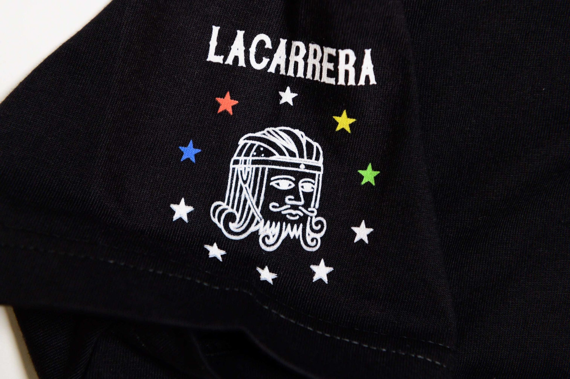 Close-up of sIeeve graphic hit on il Campionissimo black tee by LCCC highlighting premium cotton and stitching
