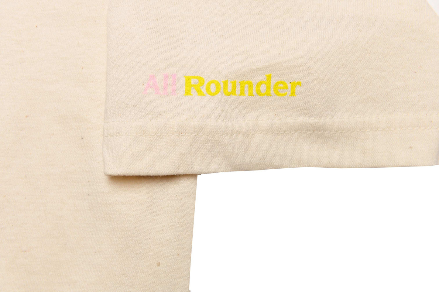 Close-up of Monsieur Chrono print sleeve detail on white/oatmeal tee by LCCC